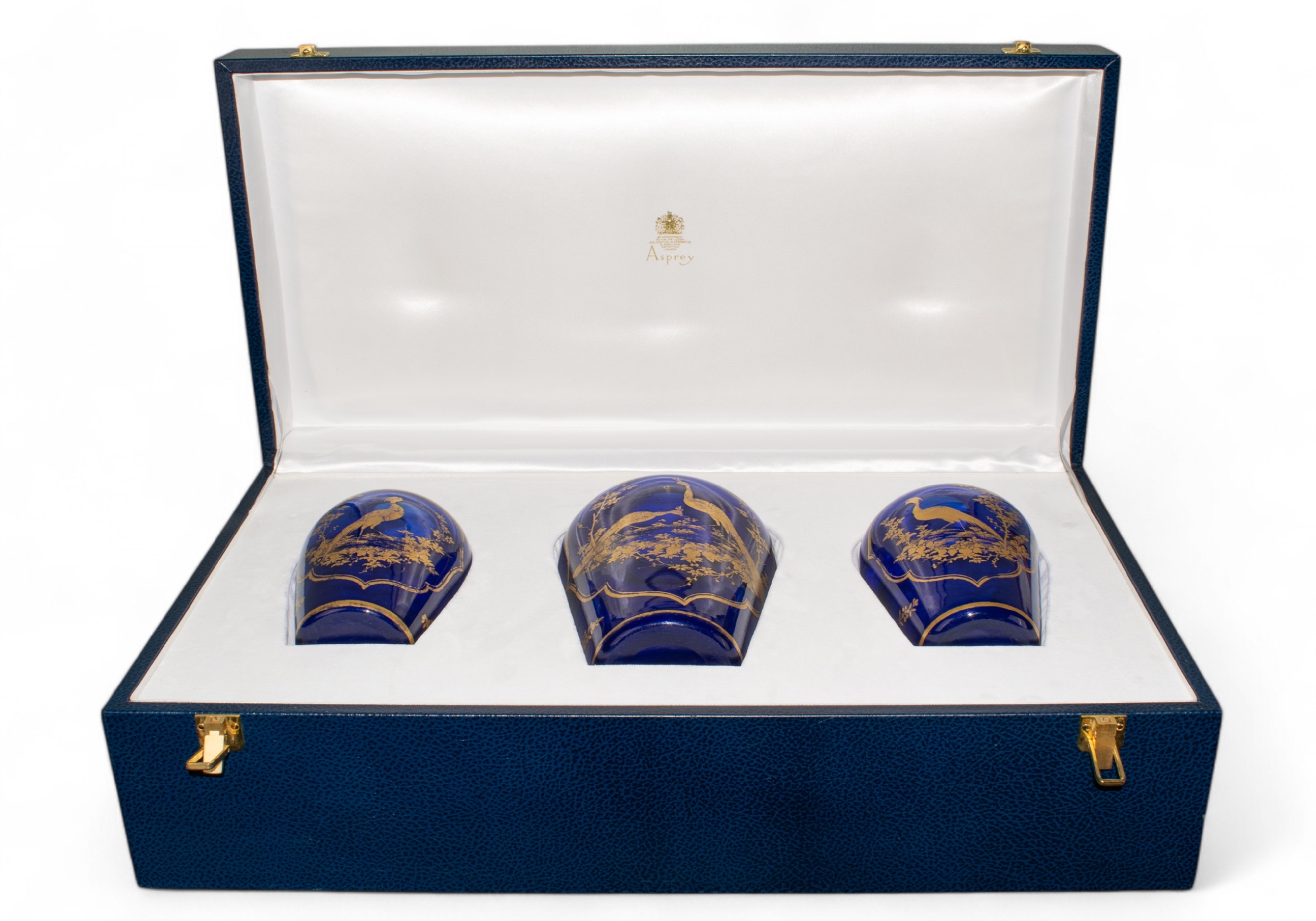 James Giles (British, 1718-1780), circa 1770 A rare trio of Bristol blue glass vases with gilt peacock design within fine foliate decoration. In an Asprey fitted leather presentation case inscribed 'Investcorp / Presented to / the Rt. Hon. Baroness Thatcher of Kesteven, OM FRS. / By / Nemir A. Kirdar / President and Chief Executive Officer / To mark the opening of Investcorp's new offices at / 48 Grosvenor Street, London, W1 / On Thursday October 27th 1994.'